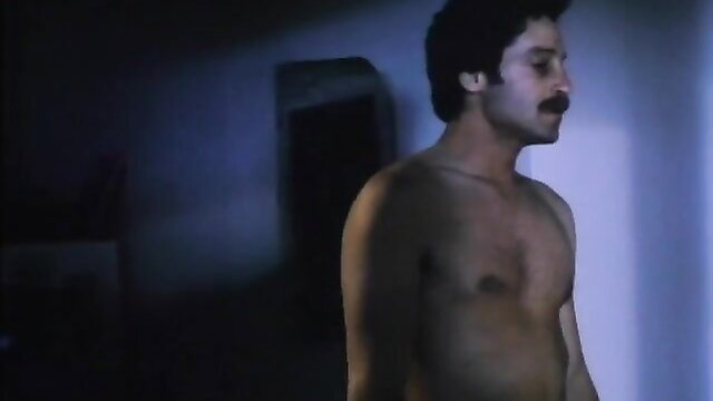 Nude hairy Latino man with mustache in shadowy voyeur scene, vintage 1985 porn