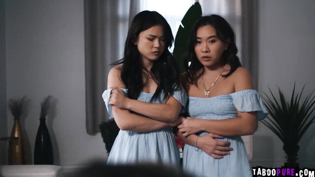 Lulu Chu and Kimmy Kimm in matching blue dresses, arms crossed