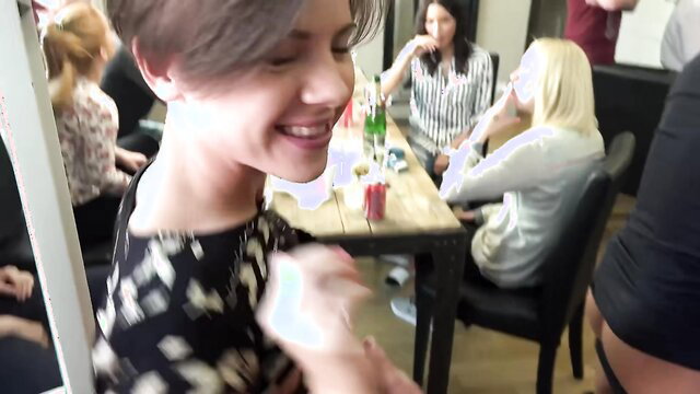 Swinging House Orgy Softcore - Smiling brunette with friends at party table