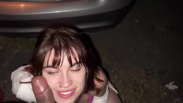 French redhead Carla Vyxx sucks cock outdoors at night, smiling