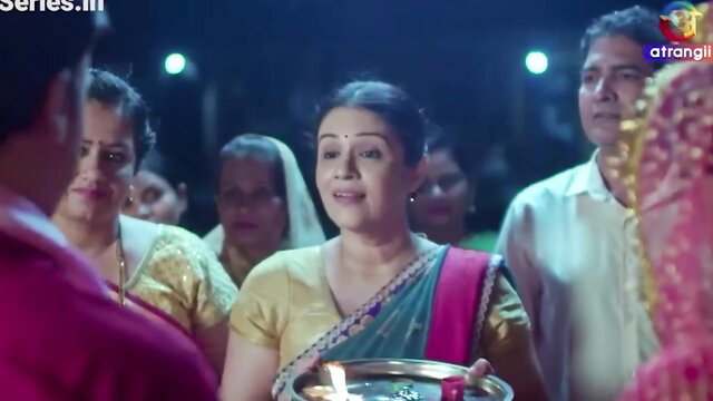 Amor Hilton as Indian bhabhi in gold saree at wedding aarti ritual
