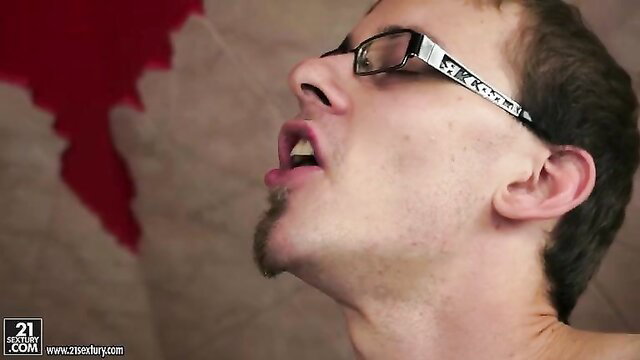 Skinny short-haired mature brunette with glasses blows cock closeup