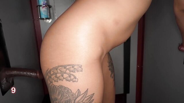 Yazmin Royal tattooed hip in gloryhole booth, nude ass curve