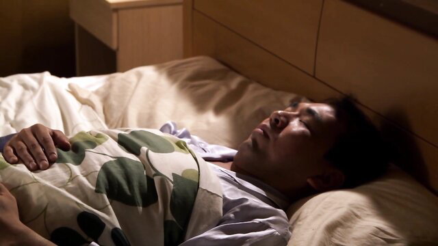 Stressed Asian husband asleep in bed, ignored by wife in JAV cuckold scene