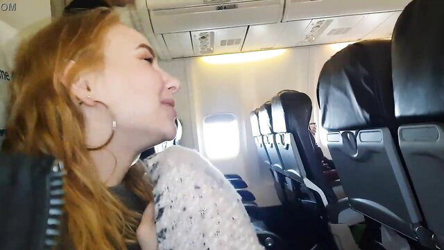 Bella Mur redhead smiling on airplane seat in public tease
