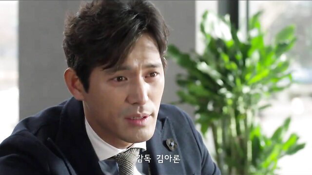 Handsome Asian man in suit, intense office gaze, Korean drama style thumbnail