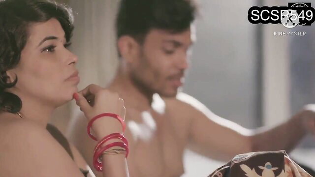 Curvy Indian woman in bangles touches lips as topless BF caresses her