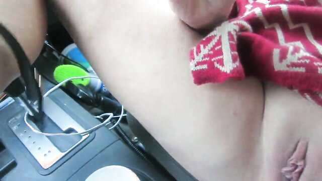 Amateur solo woman masturbating with shoes on nipples and pussy in car