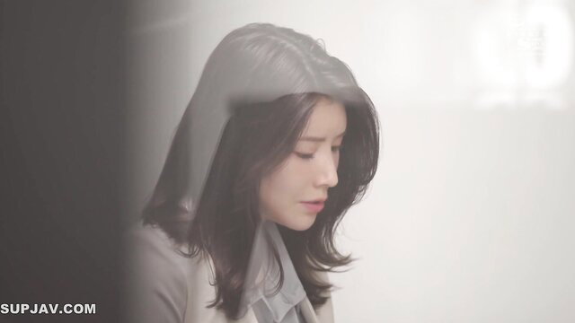 Hikaru Hozuki busty Japanese secretary in hooded gray coat, soft gaze