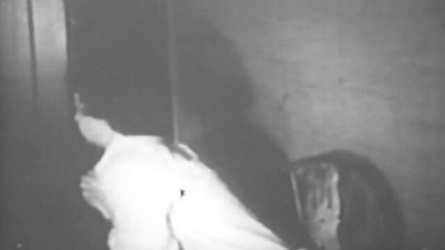 Retro vintage porn thumbnail of nude woman bent over toilet in grainy black & white