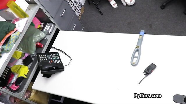 Petite Latina suspect in messy office with handcuffs and metal detector