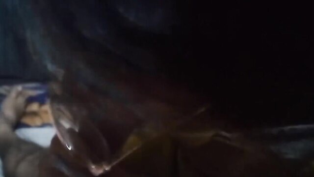 Desi Indian woman sucking cock in dim light closeup