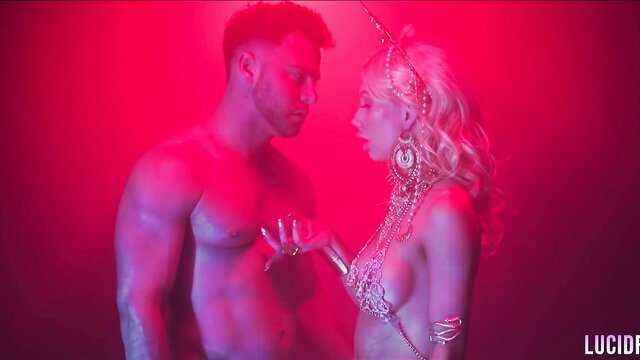 Ivy Wolfe in erotic red-lit embrace with muscular man, LucidFlix Void