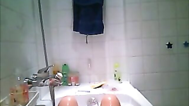 Chubby white wife big tits legs spread in bathtub hidden cam