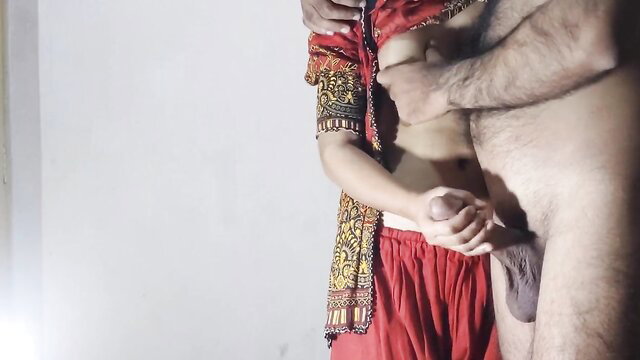 Desi woman in red skirt grabs man's cock in Desperate Desi Dangler bukkake scene