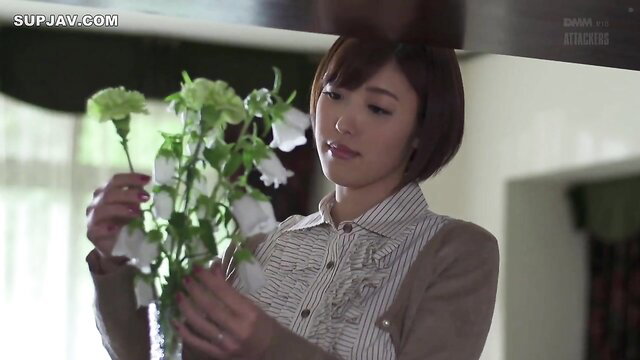 Mizuno Asahi holding white flowers, busty mature Japanese woman in blouse