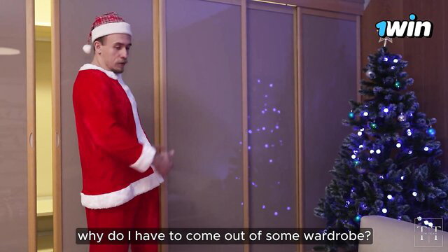 Luna Rishi as sexy Santa emerging from wardrobe in Christmas scene