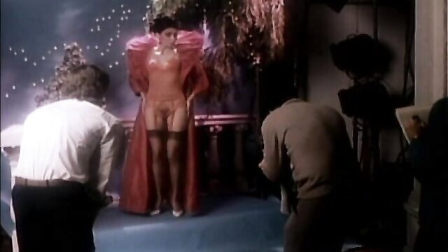 Redhead retro star in sheer red lingerie posing nude on set, 1981 Outlaw Ladies