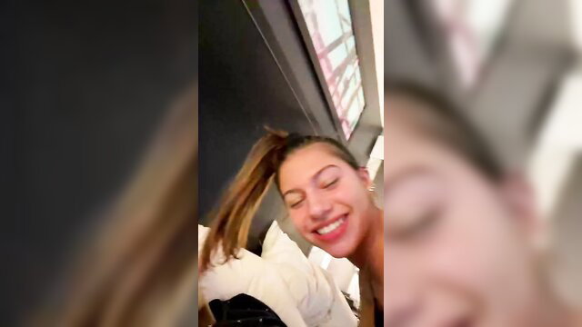 Carlie Marie smiling in bed with ponytail, hot amateur tease