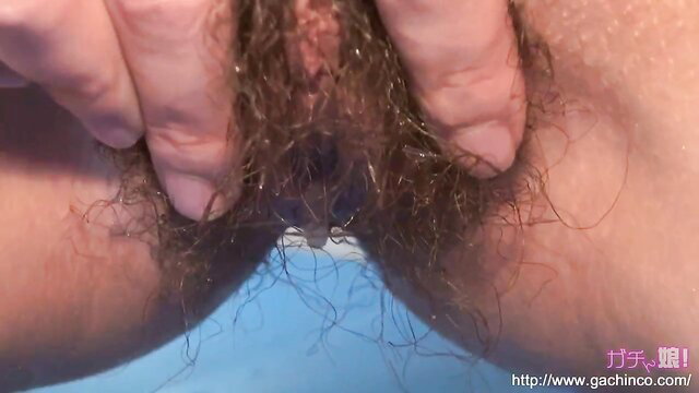 Japanese slut spreads hairy pussy closeup in solo piss fetish thumbnail