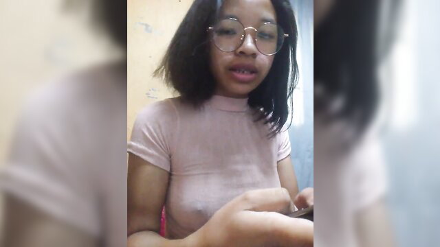 Asian bob haircut teen in tight pink top, glasses, amateur selfie