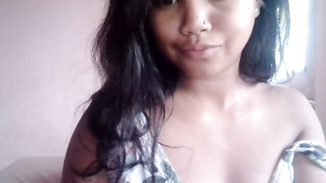 Sexy Asian amateur with long black hair bares shoulders and cleavage closeup