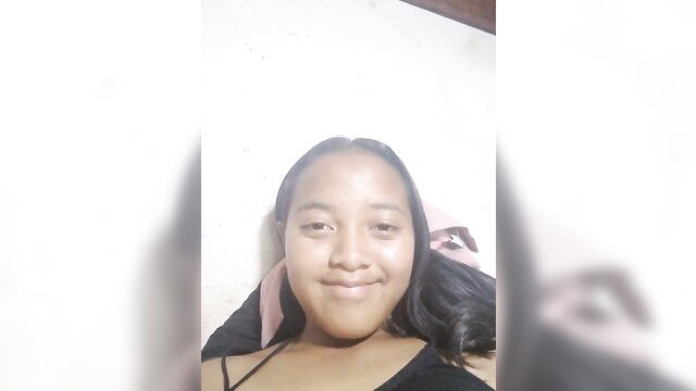 Malagasy amateur teen smiling in black spaghetti strap top closeup