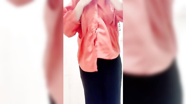 Malaysian girl in pink satin blouse and black pants posing sexy