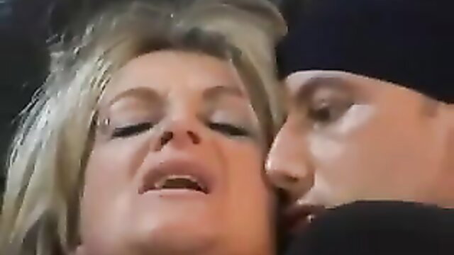 Blonde mature MILF with big tits passionately kisses man in hardcore scene