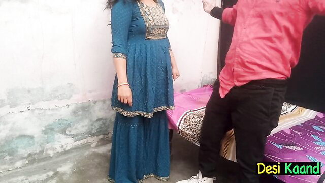 Desi mom in blue salwar kameez stands by bed in homemade Desi Kaand video