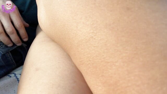 Maya's smooth thigh and hip exposed in beach tease by Maya y Thor