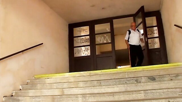 Grandpa Mireck enters building in outdoor seduction scene