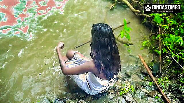 Desi girl Sudipa wet in sheer saree by waterfall, sexy pose