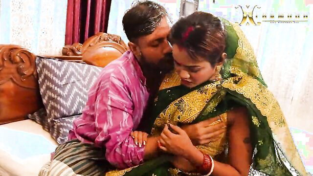 Indian bhabhi in green saree passionately kissed by horny devar on sofa