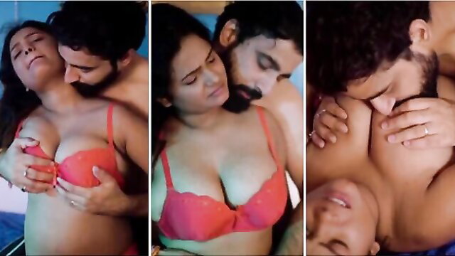 Indian busty beauty in red bra passionately kisses lover in bed