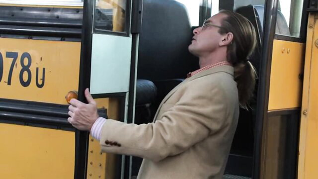 Riley Steele Teachers Sc. 3 thumbnail: ponytail man thumbs up at school bus door