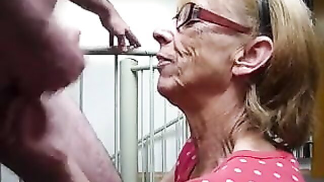 Old blonde neighbor in polka dot top kneels for intense blowjob