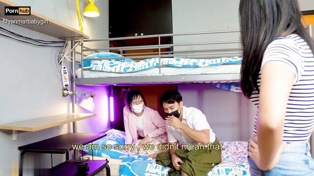 Asian girl confronts two men in a room