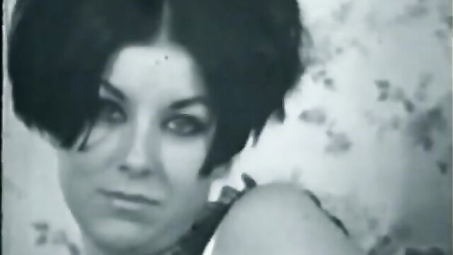 Vintage brunette with retro bob haircut in sultry close-up pose