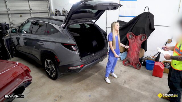 Ashley Tee in scrubs offers pussy service at car garage