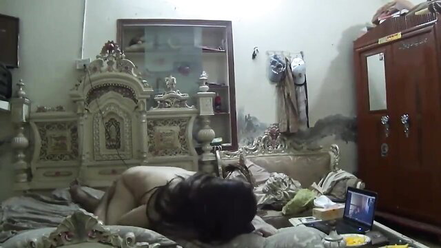 Nude Desi wife lying naked on bed in amateur Paki video