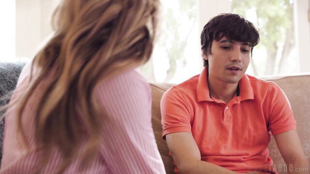 Pristine Edge chats intimately with young man on couch in Edge Mommy