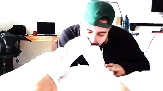 Guy in green cap rimming jock's ass in bed, gay anal tease