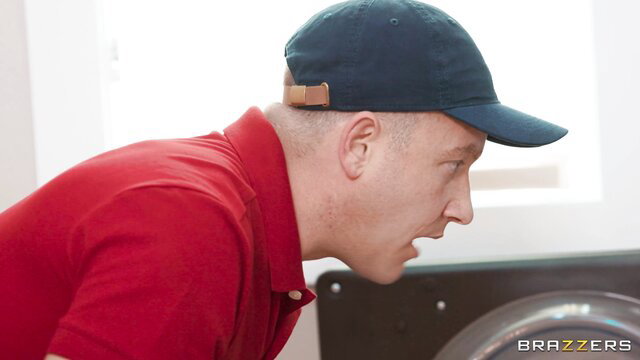 Maddy O'Reilly in red shirt and cap sniffs laundry in Brazzers Maddy's Desperate Dilemma