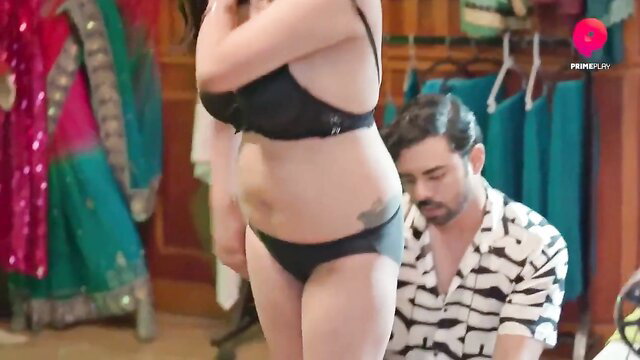 Naughty Indian MILF in black lingerie with man kneeling behind