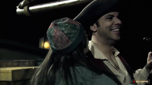 Pirates 2: Stagnetti's Revenge - pirate man smiles at woman in costume