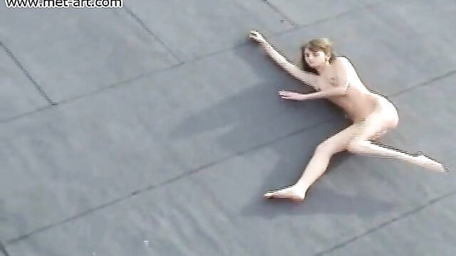 Nude Inna C stretched on rooftop, slim body exposed, Met Art