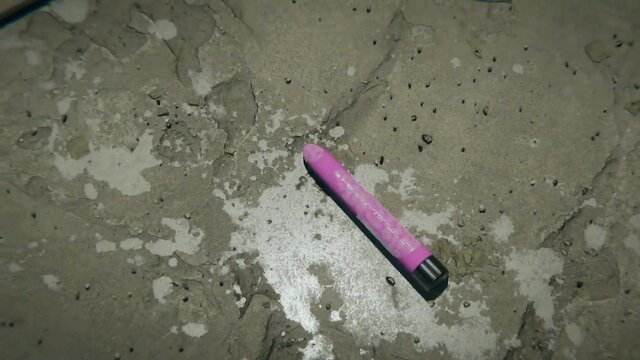 Pink strapon dildo on dirty floor in Lara Croft slave fetish scene