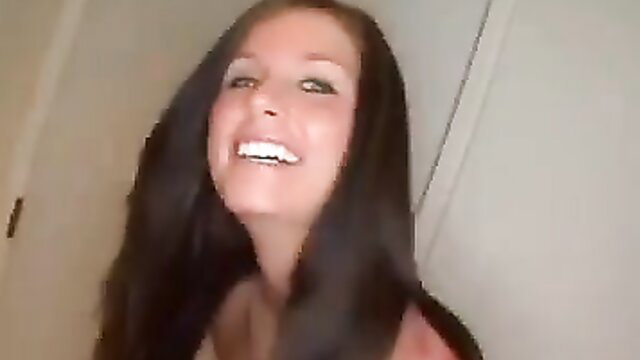 Smiling brunette beauty with full lips in teasing closeup