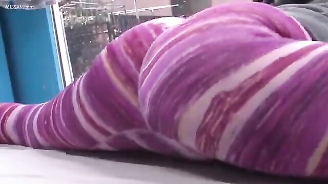 Thick ebony woman in striped purple leggings, massive ass up closeup